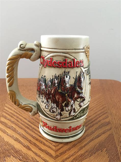 1999 <b>Budweiser</b> Holiday <b>beer</b> <b>Stein</b> CS389 with the beautiful Clydesdale Horses pulling a wagon. . Budweiser beer stein values
